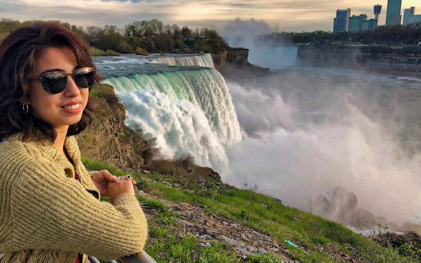 Visitor enjoying the view of Niagara Falls on a USA Secret Caverns/Watkins Glen tour.
