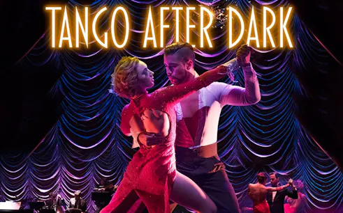 Dancers performing tango on stage with "Tango After Dark" sign above.