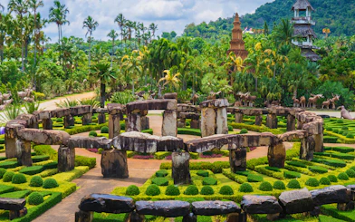 Nong Nooch Tropical Garden stone circle and lush greenery in Pattaya, Thailand.