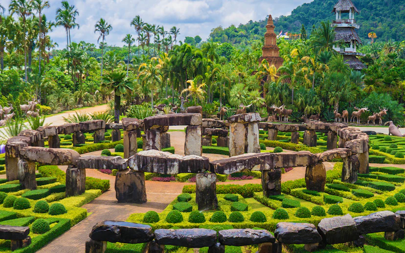 Nong Nooch Tropical Garden stone circle and lush greenery in Pattaya, Thailand.