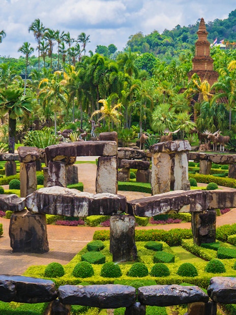 Nong Nooch Tropical Garden stone circle and lush greenery in Pattaya, Thailand.