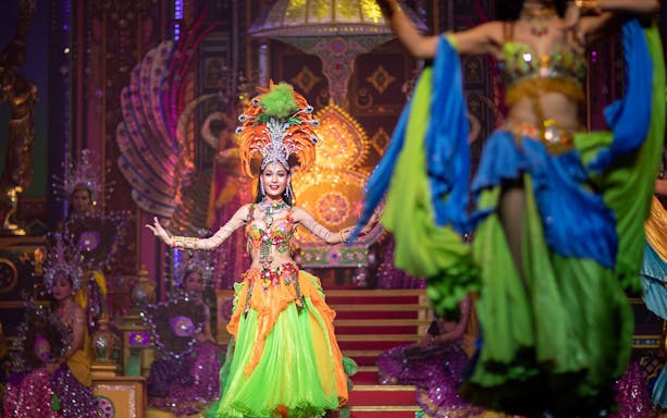 Performer in vibrant costume on stage at Alcazar Cabaret Pattaya.