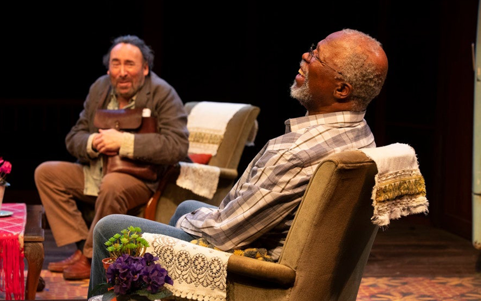 Two actors performing a scene from "Kunene and the King" on stage.