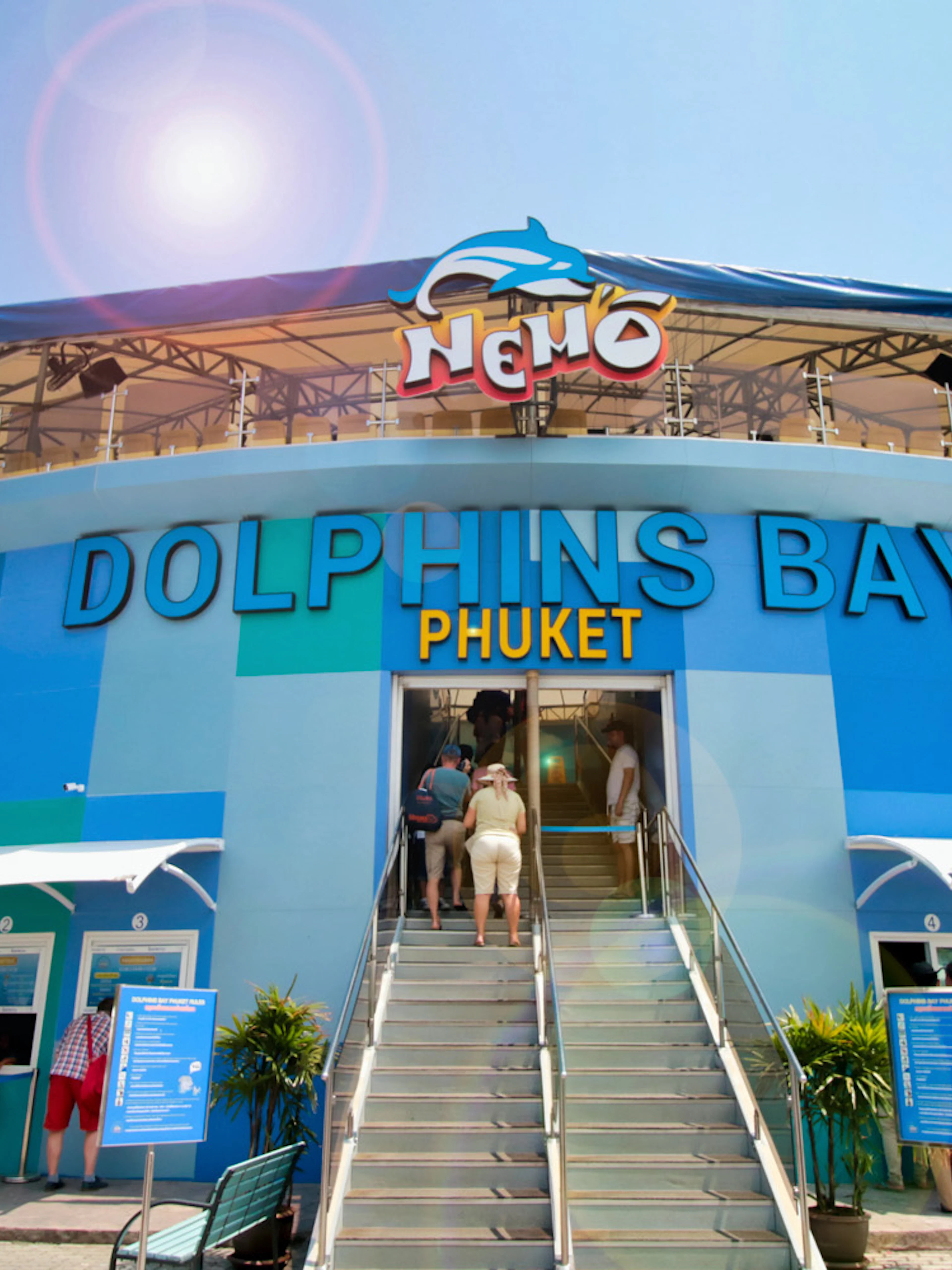 Phuket Dolphins Bay entrance with visitors buying tickets.