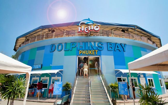 Phuket Dolphins Bay entrance with visitors buying tickets.