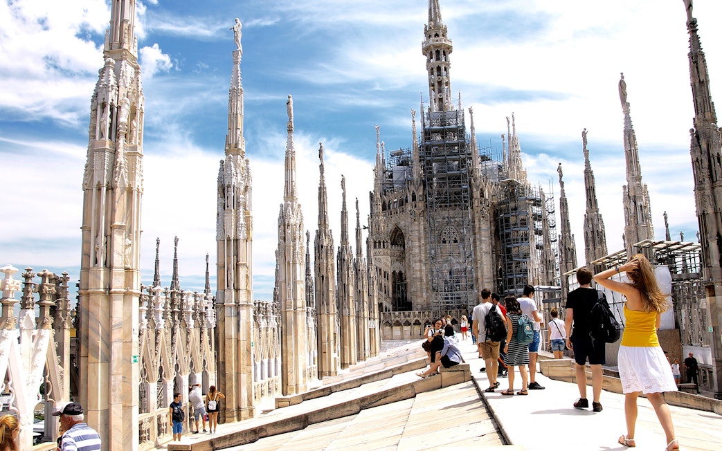 Visitors walking on the rooftop of Milan Duomo, Italy.