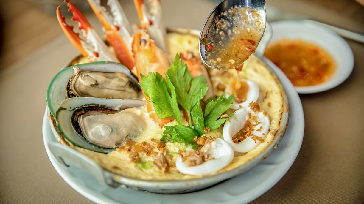 Seafood platter with mussels, crab, and herbs