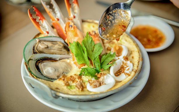 Seafood platter with mussels, crab, and herbs at Baiyoke Floating Market Buffet, Baiyoke Sky Hotel.