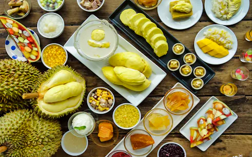Fruit buffet with durian, mango, and assorted desserts at Baiyoke Sky Hotel 18th Floor.