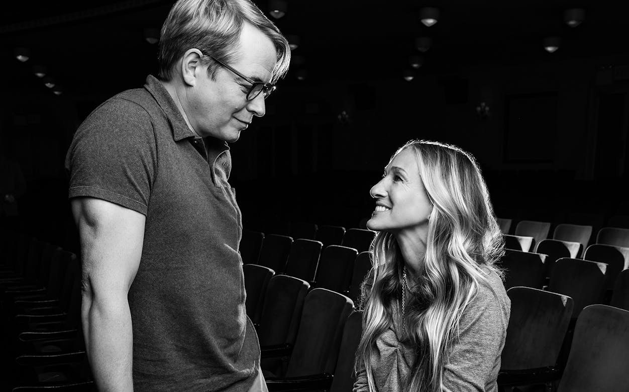 Two people smiling at each other in a theater setting for Plaza Suite.