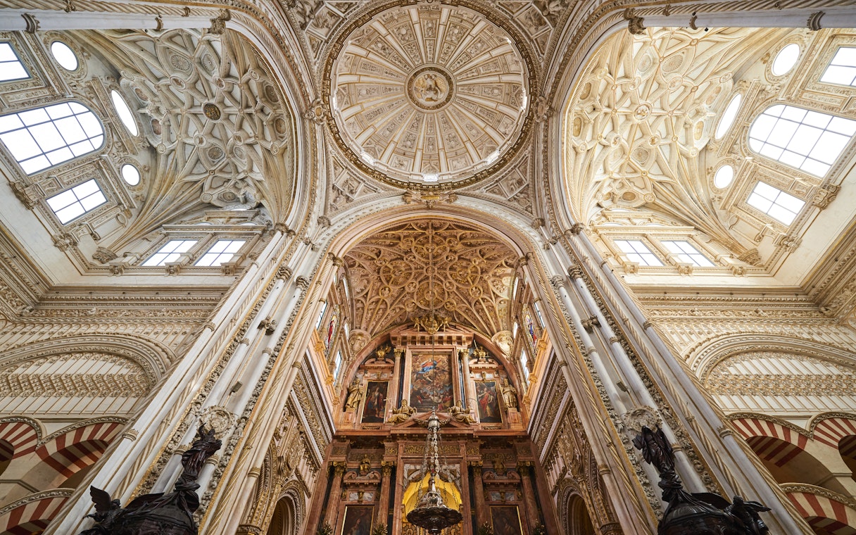 Córdoba Cathedral-Mosque interior with ornate arches and columns, Skip-the-Line Tickets available.