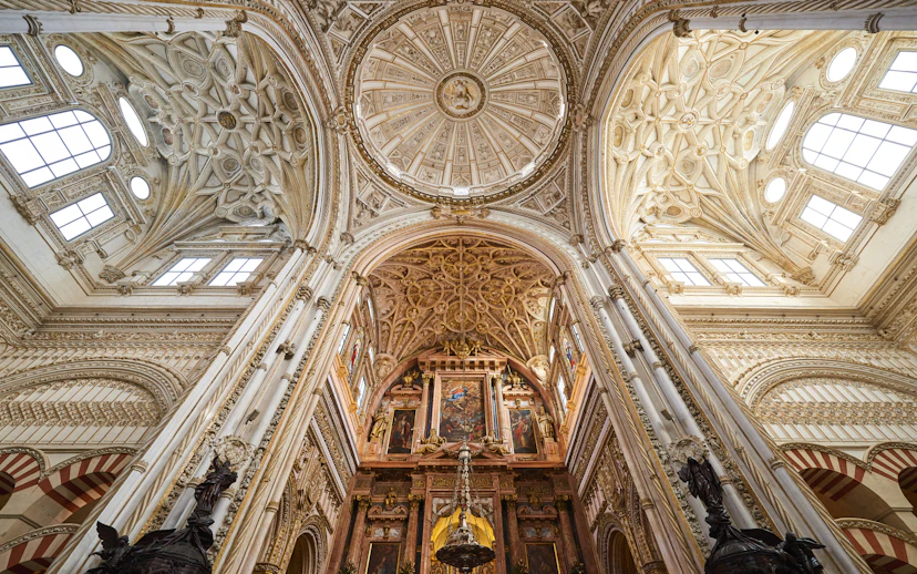 Córdoba Cathedral-Mosque interior with ornate arches and columns, Skip-the-Line Tickets available.