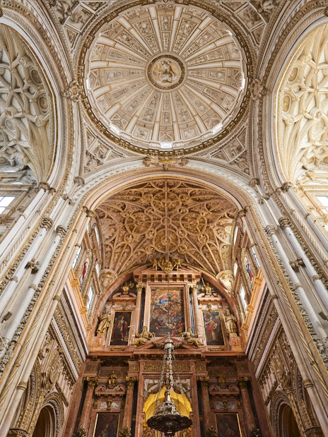 Córdoba Cathedral-Mosque interior with ornate arches and columns, Skip-the-Line Tickets available.