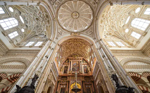 Córdoba Cathedral-Mosque interior with ornate arches and columns, Skip-the-Line Tickets available.