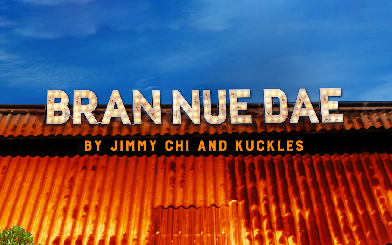 Bran Nue Dae sign with lights against a blue sky backdrop