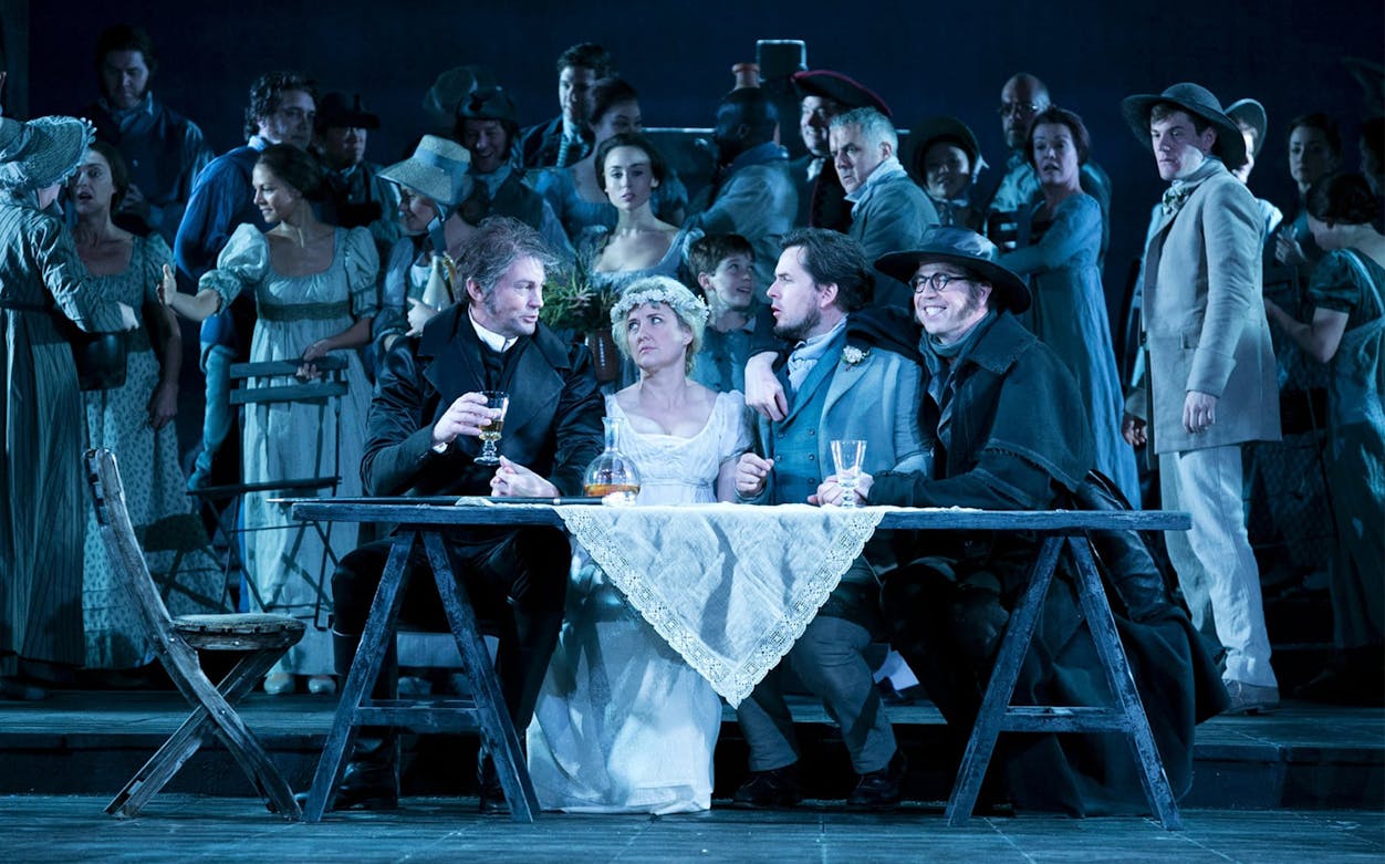 Opera cast performing Don Giovanni on stage with period costumes.