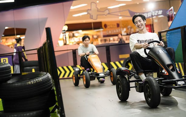 Visitors enjoying go-karting at Super Park Bangkok Indoor Activity Park.