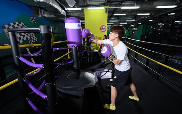 Person practicing boxing at Super Park Bangkok Indoor Activity Park.