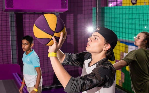 Person playing basketball at Super Park Bangkok Indoor Activity Park.