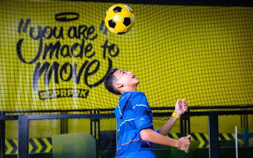 Person playing soccer at Super Park Bangkok Indoor Activity Park.