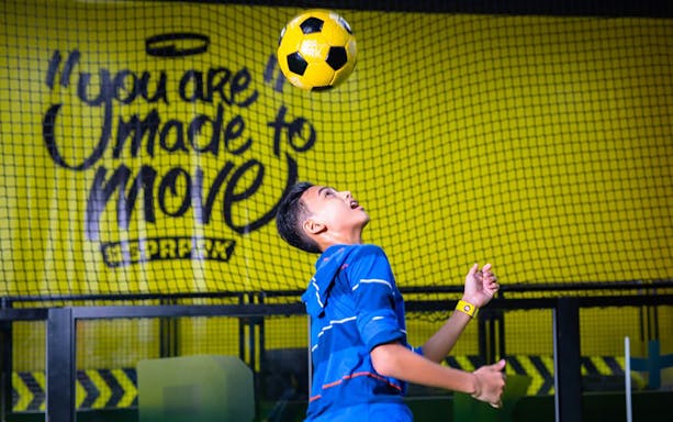 Person playing soccer at Super Park Bangkok Indoor Activity Park.