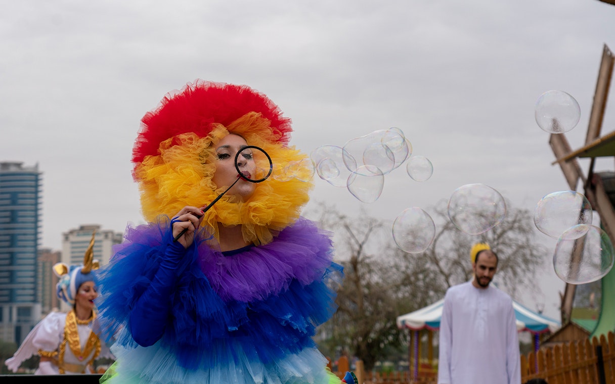 Performer blowing bubbles at Al Montazah Water Park, Sharjah.