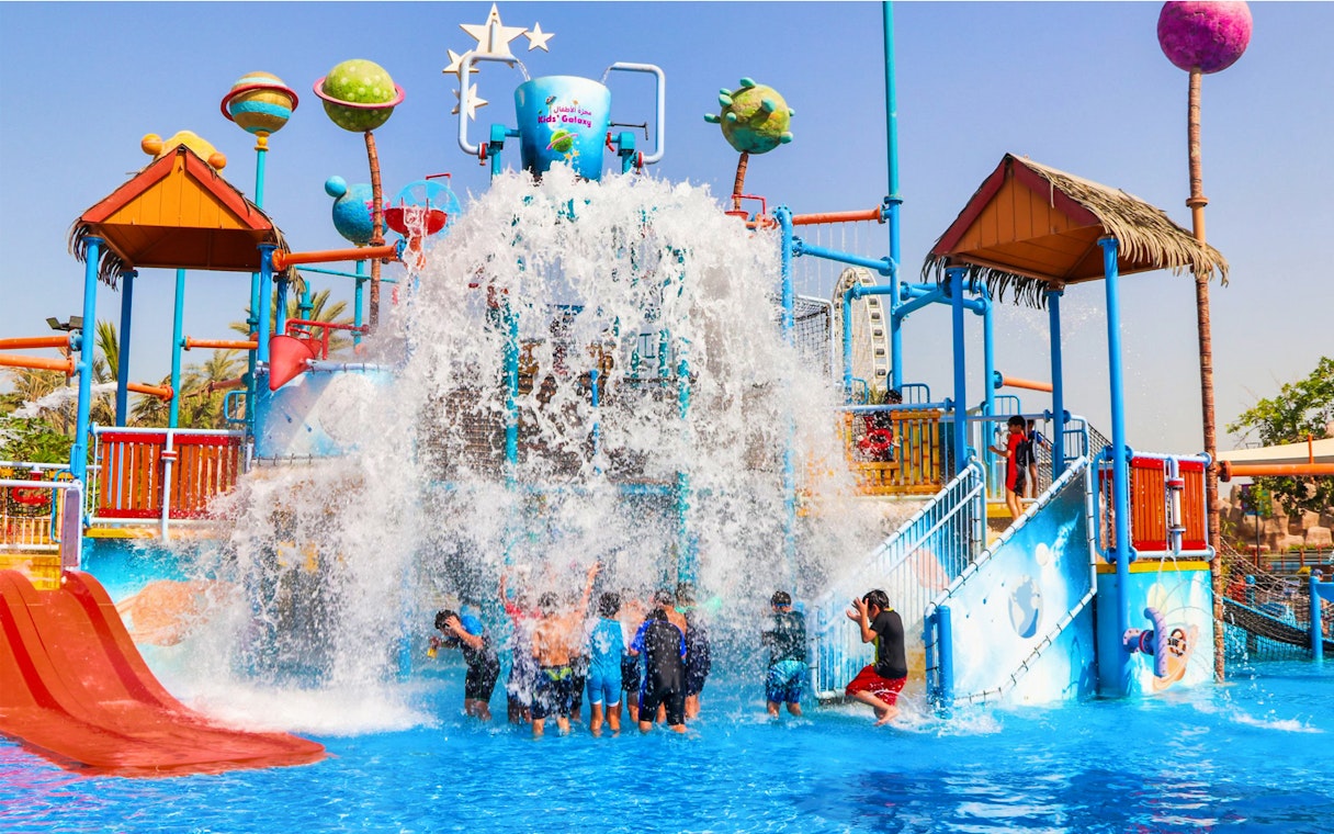 Children enjoying water play area at Al Montazah Water Park, Sharjah.