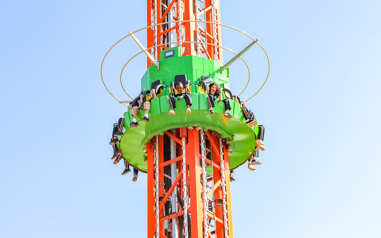 Visitors on a drop tower ride at Al Montazah Water Park.