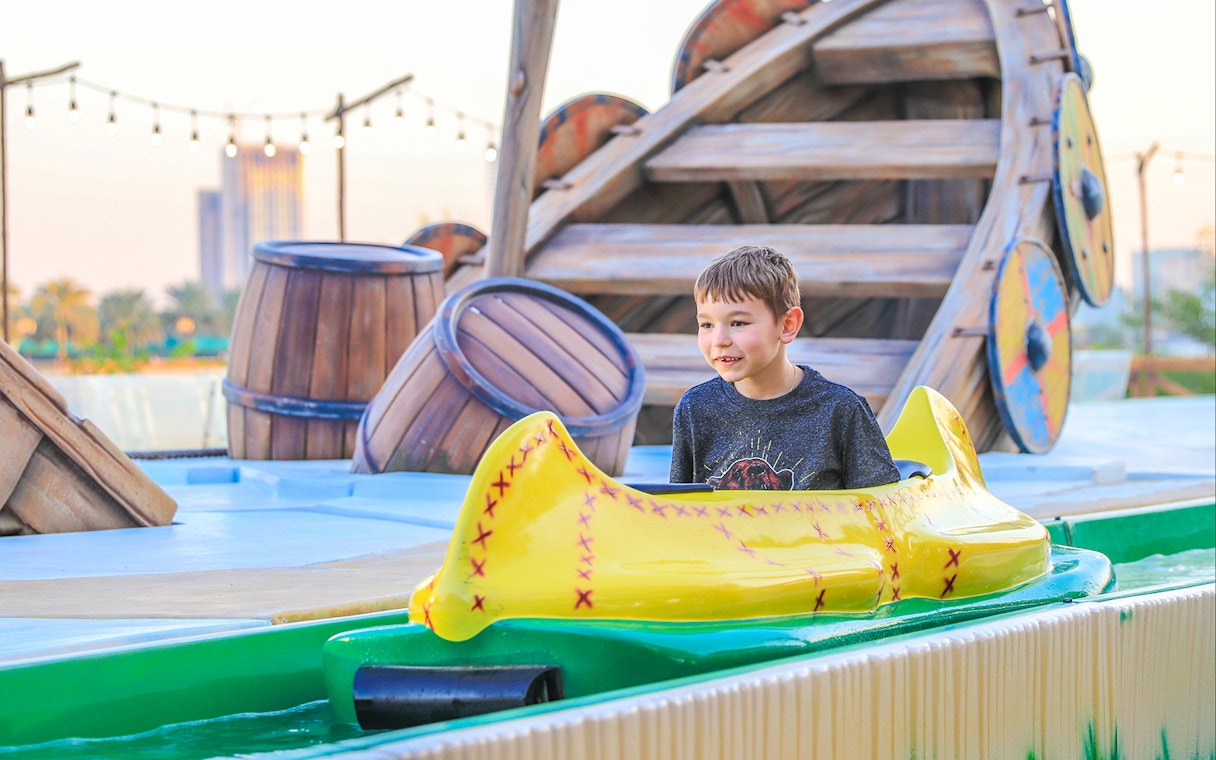 Child enjoying a water ride at Al Montazah Water Park, Sharjah.
