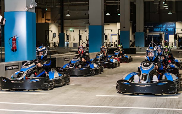 Go-kart racers at EKart Zabeel Karting Zone, Dubai Mall.