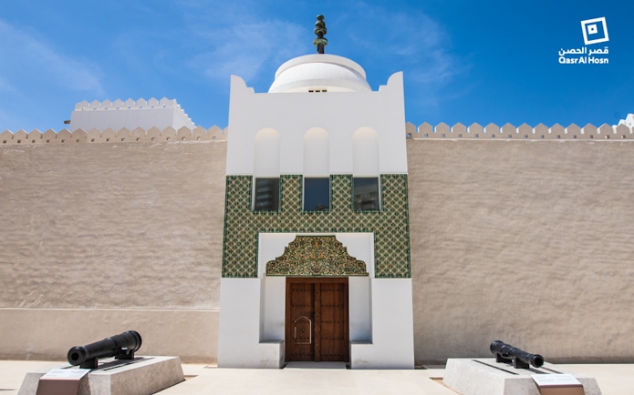 Qasr Al Hosn entrance with traditional architecture and cannons, Abu Dhabi.