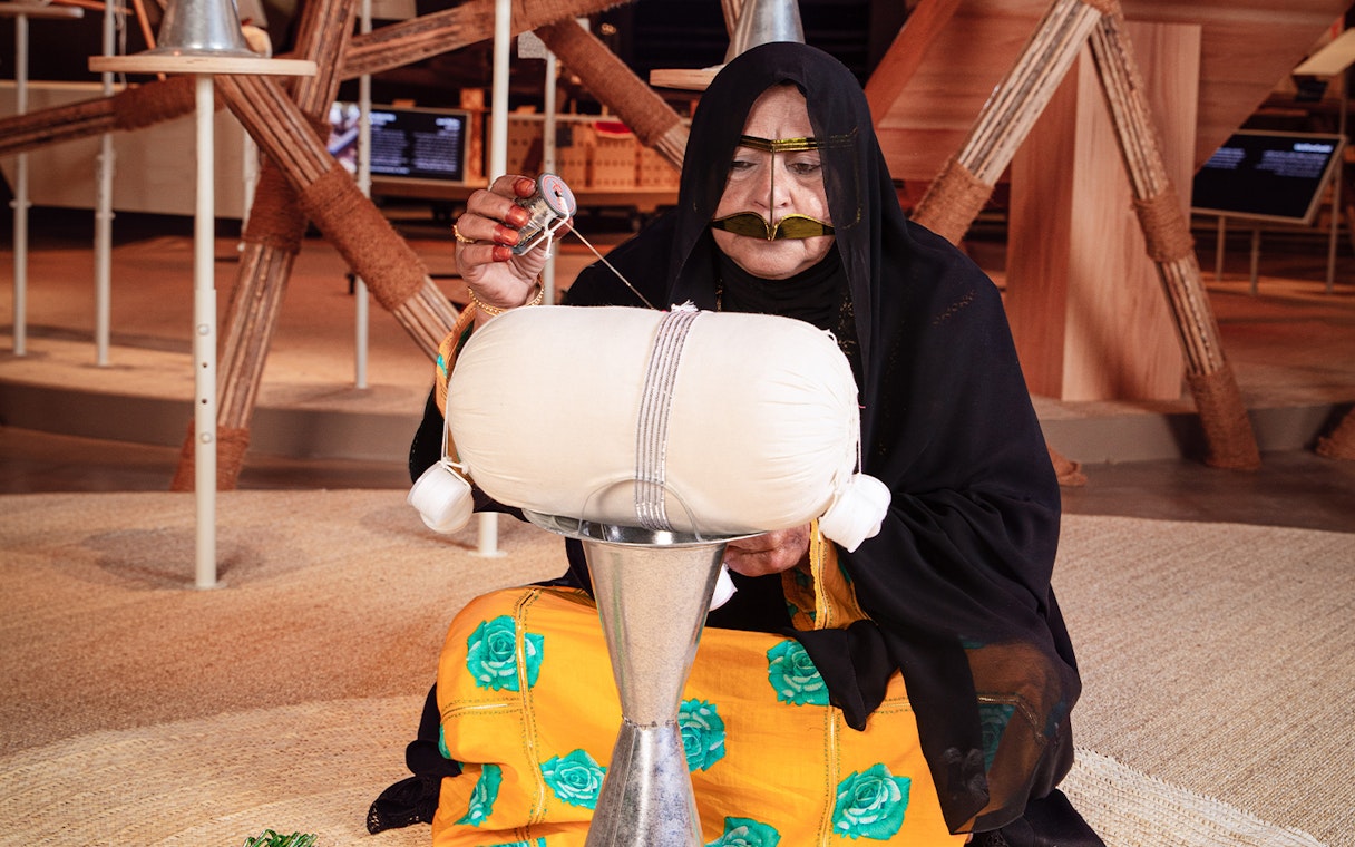 Craftswoman demonstrating traditional weaving at Qasr Al Hosn, Abu Dhabi.