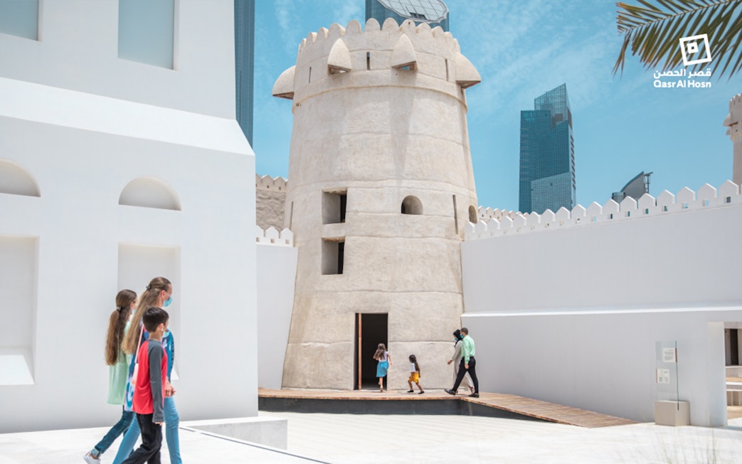 Visitors exploring Qasr Al Hosn fort in Abu Dhabi.