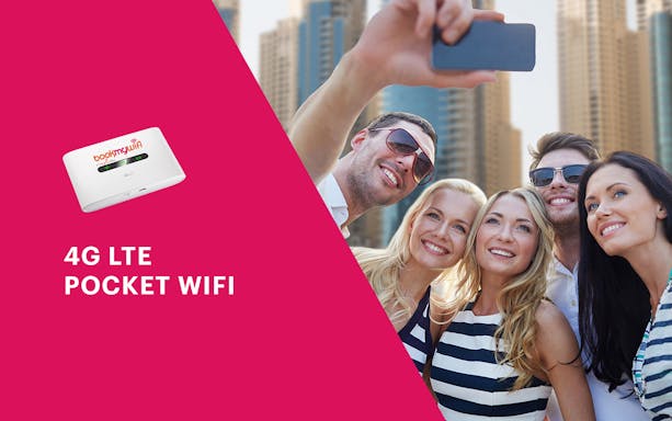 Group taking selfie with Dubai skyline, promoting City Sightseeing Dubai Hop-On-Hop-Off Pass with Wi-Fi.