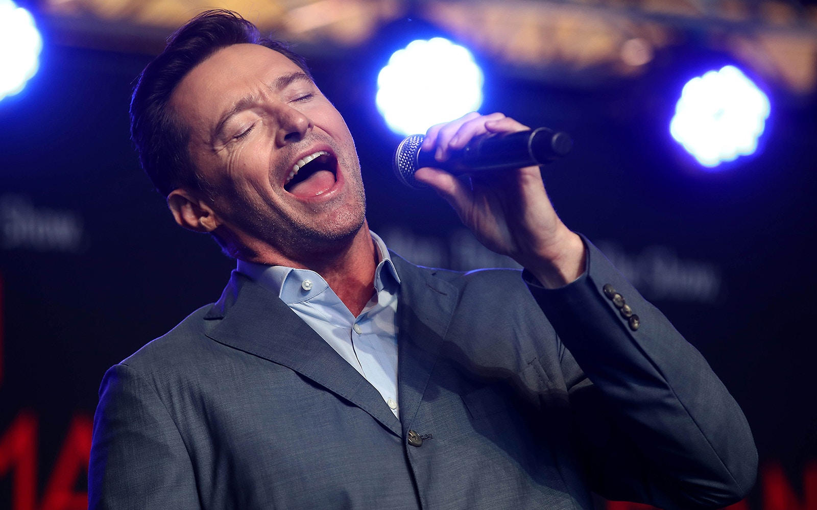 Singer performing on stage during The Music Man event.