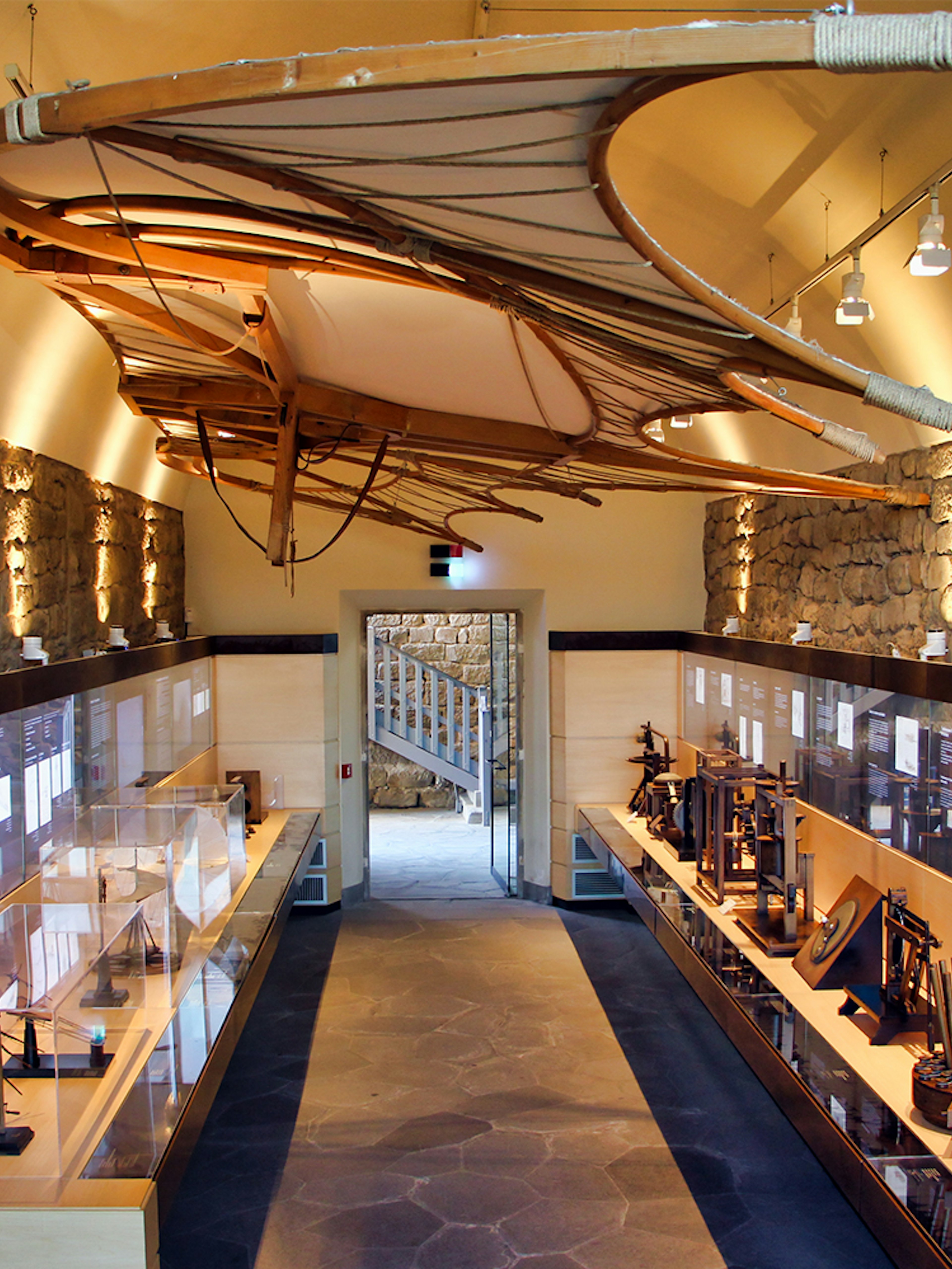 Leonardo Da Vinci Museum exhibit with flying machine model and interactive displays.
