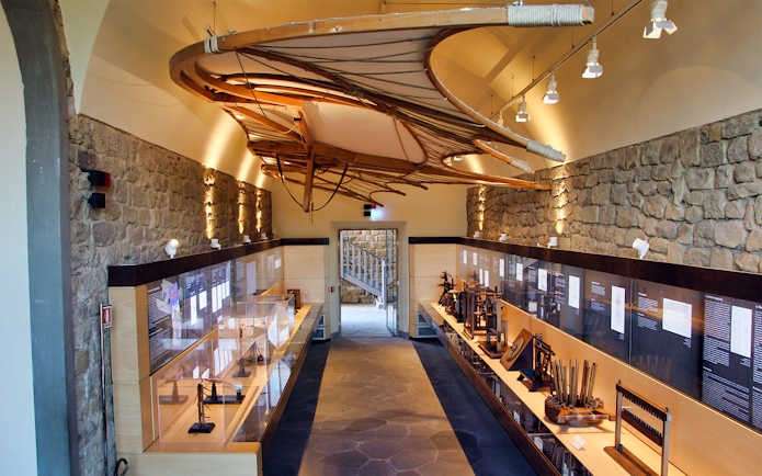 Leonardo Da Vinci Museum exhibit with flying machine model and interactive displays.