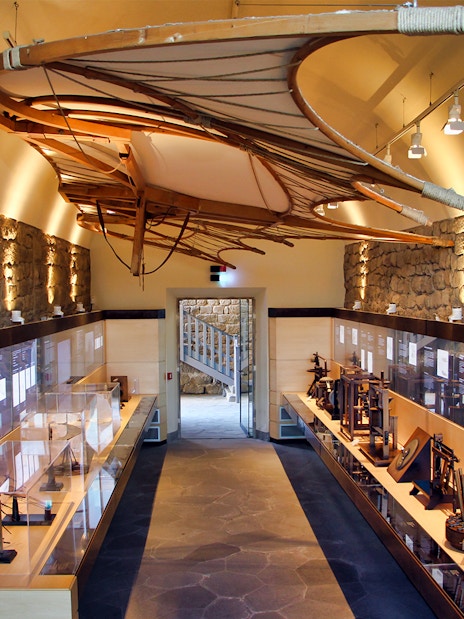 Leonardo Da Vinci Museum exhibit with flying machine model and interactive displays.
