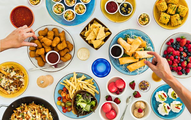 Assorted dishes at Sydney Tower Buffet Rotating Restaurant, including spring rolls and fresh berries.