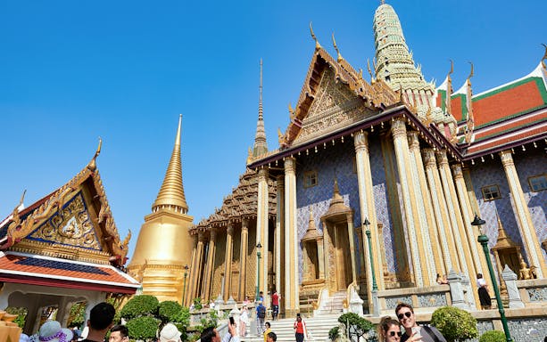 Grand Palace Bangkok with tourists on Siam Hop-On-Hop-Off tour.