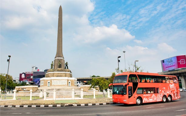 Red double-decker bus near Victory Monument in Bangkok on Siam Hop-On-Hop-Off Sightseeing Tour.