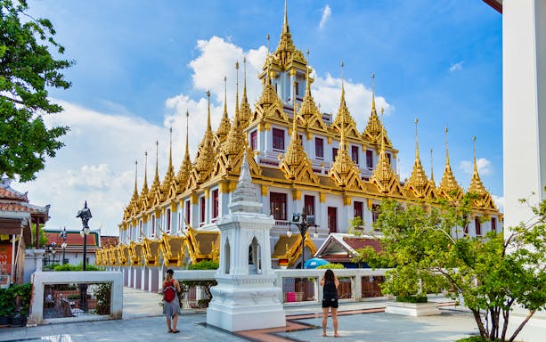 Golden spires of Loha Prasat temple in Bangkok on Siam Hop-On-Hop-Off Sightseeing Tour.