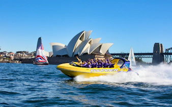 Thunder Jet boat speeding past Sydney Opera House on an adrenaline tour.