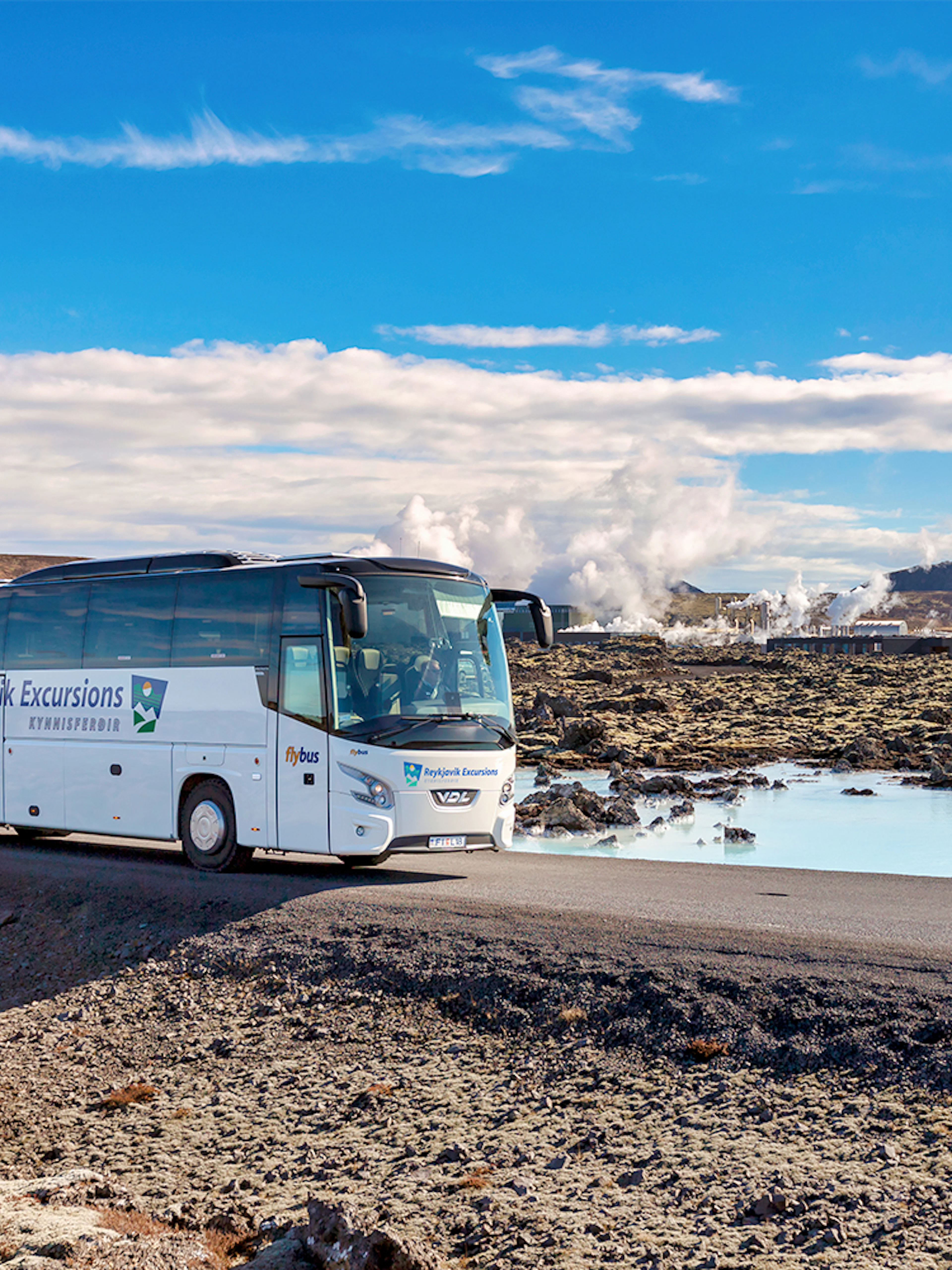 Bus on road near Blue Lagoon geothermal spa in Iceland.