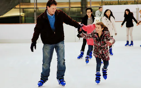 Ice skating at Hyde Park Winter Wonderland in London.
