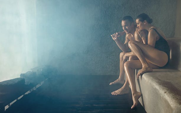 Couple relaxing in the steam at Blue Lagoon, Iceland.