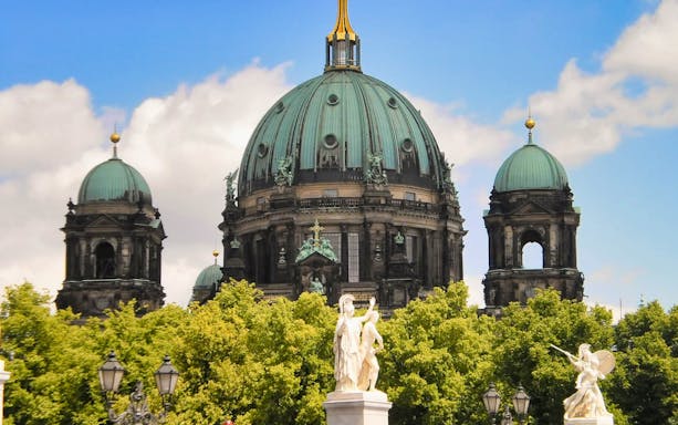 Berlin Cathedral with statues and trees in the foreground on the Reichstag Tour.