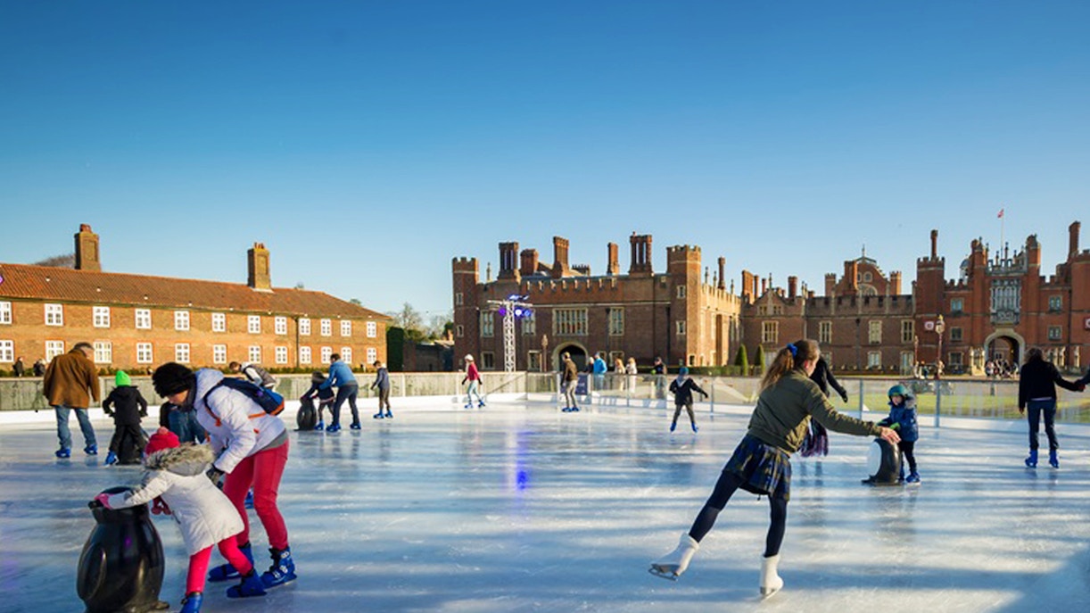 Ice skaters enjoying Hampton Court Palace Ice Rink in London.