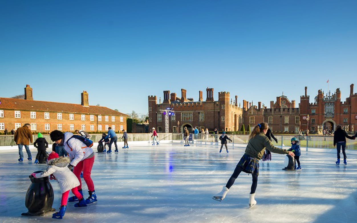 Ice skaters enjoying Hampton Court Palace Ice Rink in London.
