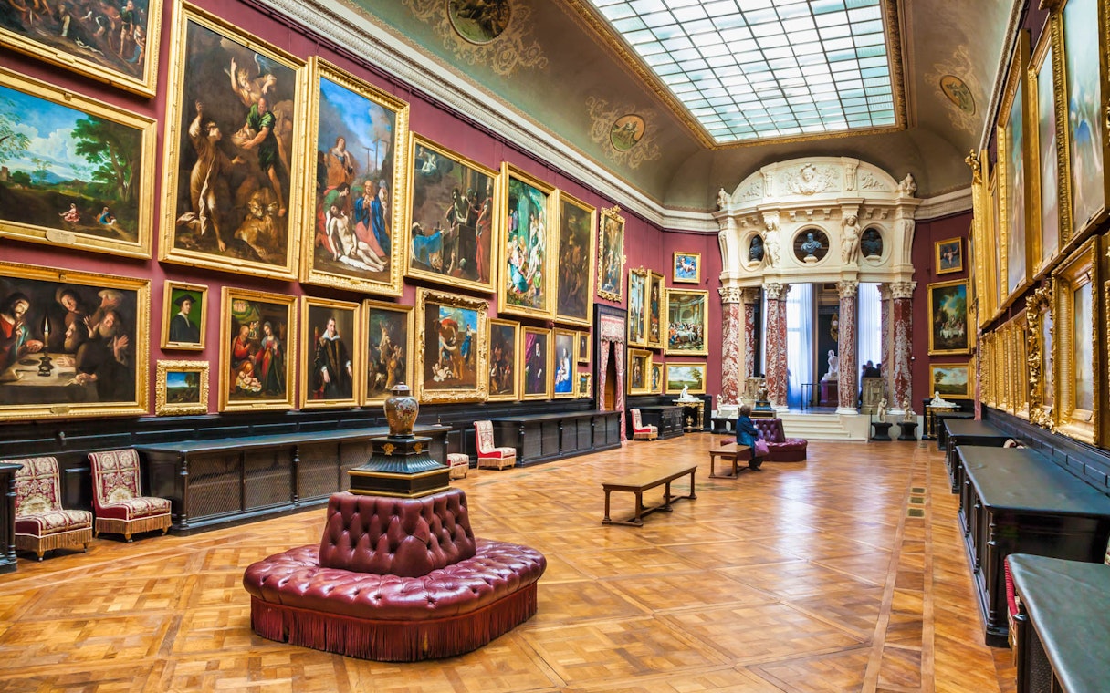 Chateau of Chantilly painting gallery with ornate artworks and elegant interior.